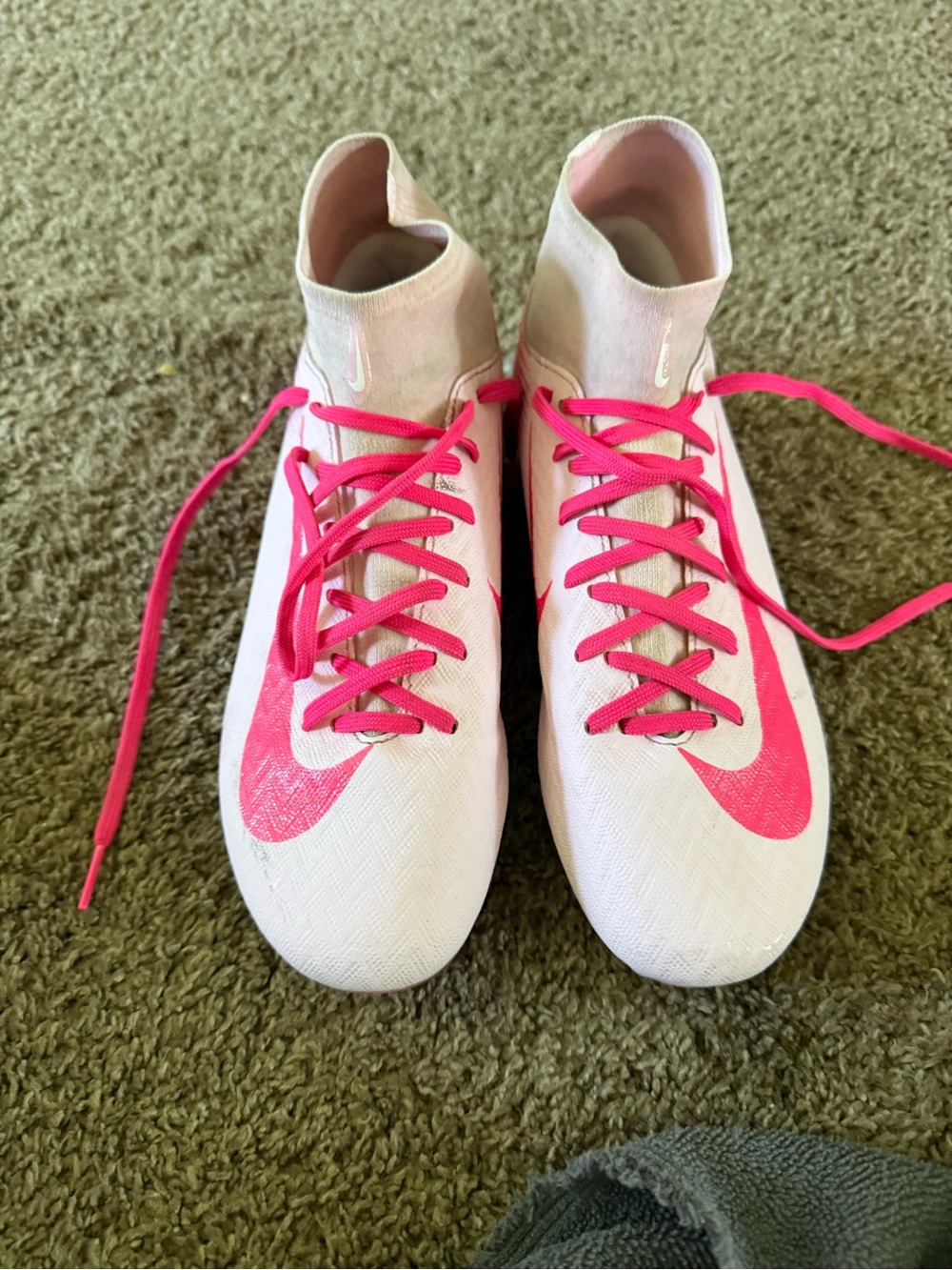 Custom Nike Women's pink and white cleats.